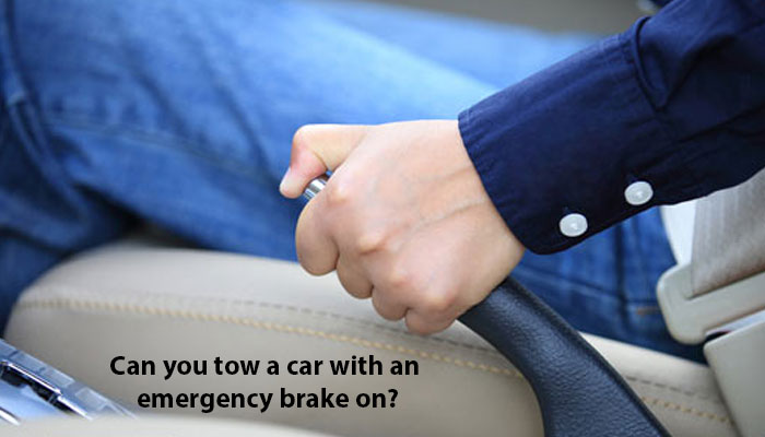 Can you tow a car with an emergency brake on?